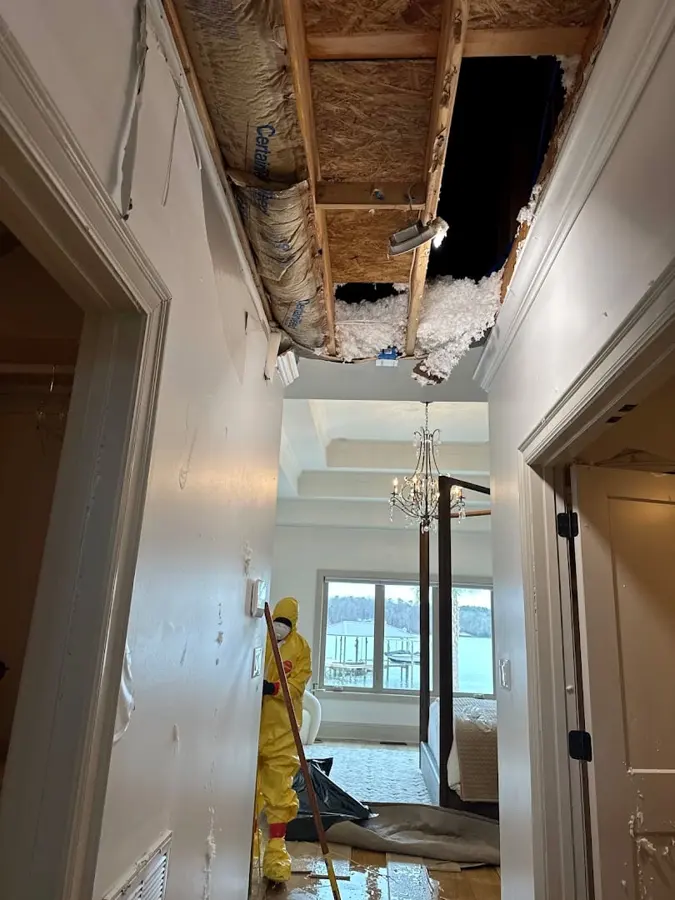 A water-stained ceiling opened to dry a leak in a Kannapolis, NC home
