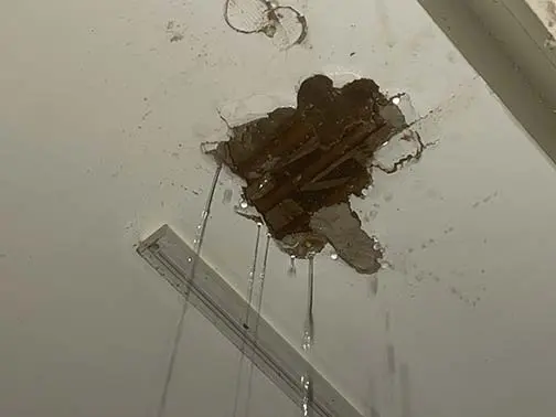 Water coming through a ceiling from a roof leak in a Kannapolis, NC home