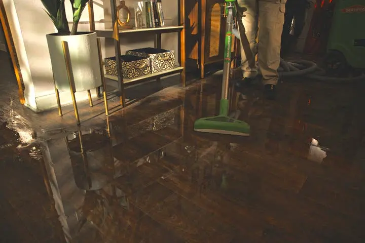 Water extraction of standing water from a hardwood floor in a Kannapolis, NC home